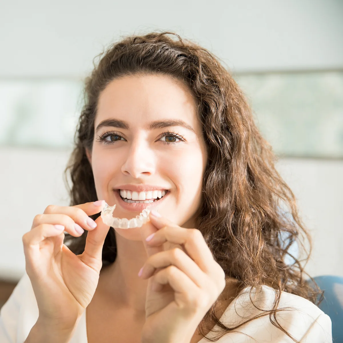 Smiling patient representing Invisalign®